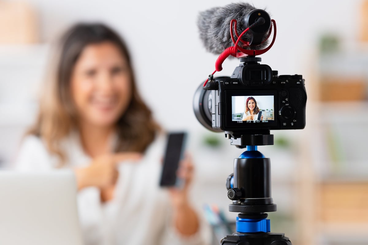 Woman recording video content for social media